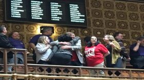 Supporters of the minimum wage celebrate in the Senate gallery after passage at nearly 3 a.m.