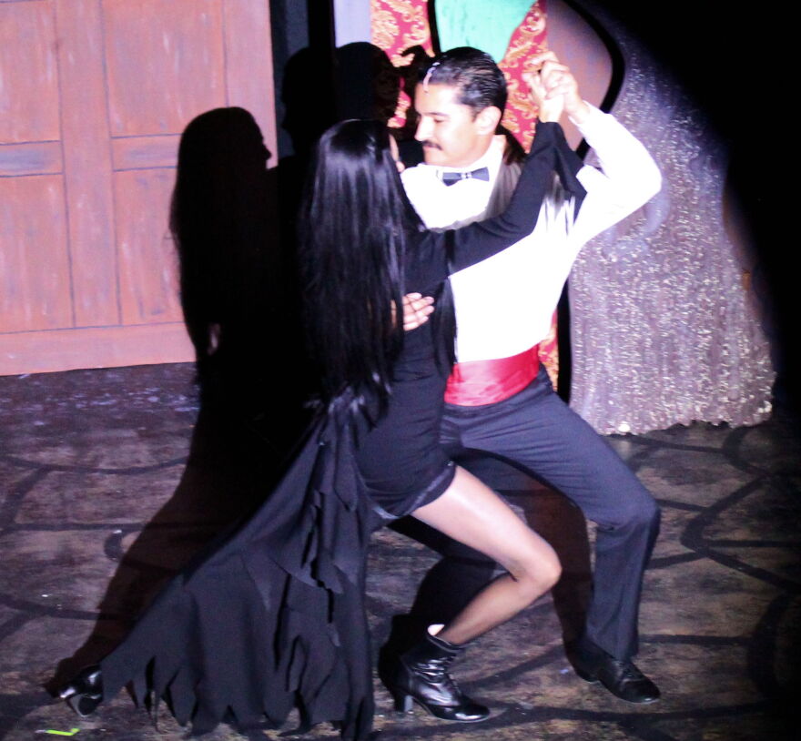 Paola Cifuentes and Parrish Danesh as Morticia and Gomez Addams dance the Tango de Amor.