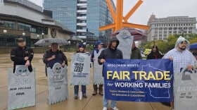 People gathered in downtown Milwaukee in support of worker-centered trade policy.