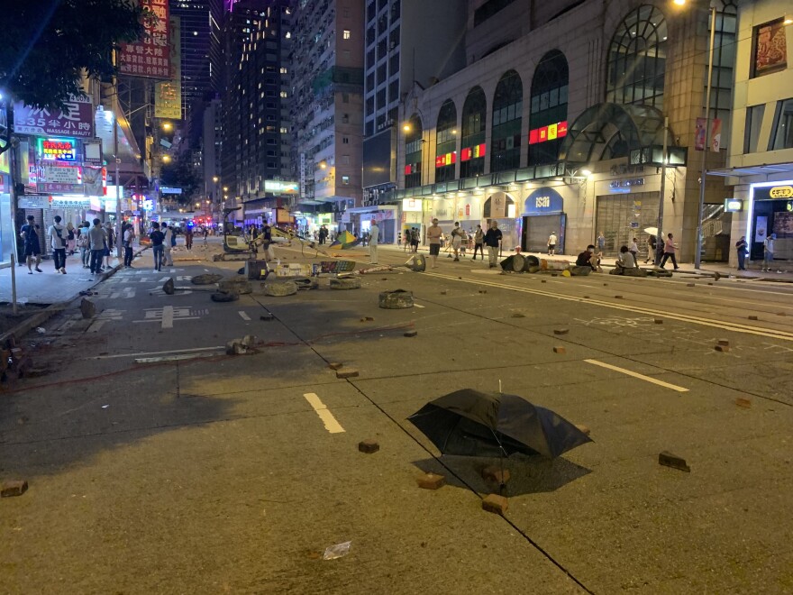 As protests in Hong Kong have continued a pattern has emerged. While protests during the day start of peaceful, they usually become violent at night as riot police and protesters clash. Protesters have smashed the storefronts of mainland Chinese banks and businesses and dug up bricks from the sidewalks to slow down the police.