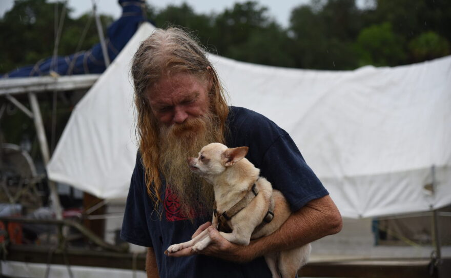 Boat owner John Bost and his dog Rascal will be keeping an eye on the boats in Steinhatchee, Fla. as Hurricane Hermine hits the Florida coast early Friday, September 2, 2016. (Jessica Rodriguez/WUFT News)