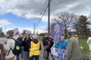Protesters across the street from Bangor International Airport protesting Vice President JD Vance's visit to Maine.