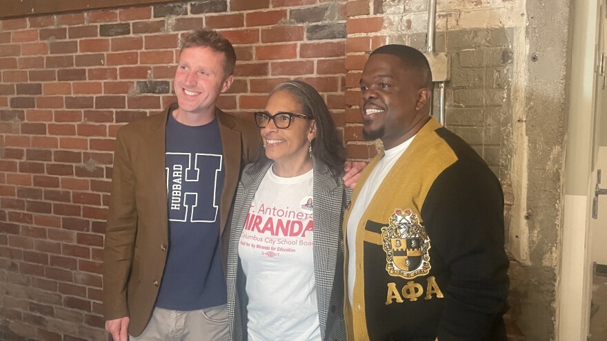 Columbus City Council candidates Patrick Katzenmeyer (left), Antoinette Miranda (center) and Jermaine Kennedy (right) post for photos at the Franklin County Democrats election night watch party at Strongwater Events venue on November 4, 2025.