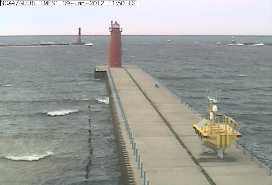 The yellow research buoy pictured by NOAA's live webcam on January 9th, 2012. The buoy will still collect wind data from this location before heading back out to the middle of Lake Michigan in early March.