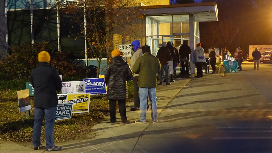Voters wait in line outside the MLK Center at 38th and Meridian streets in Indianapolis.