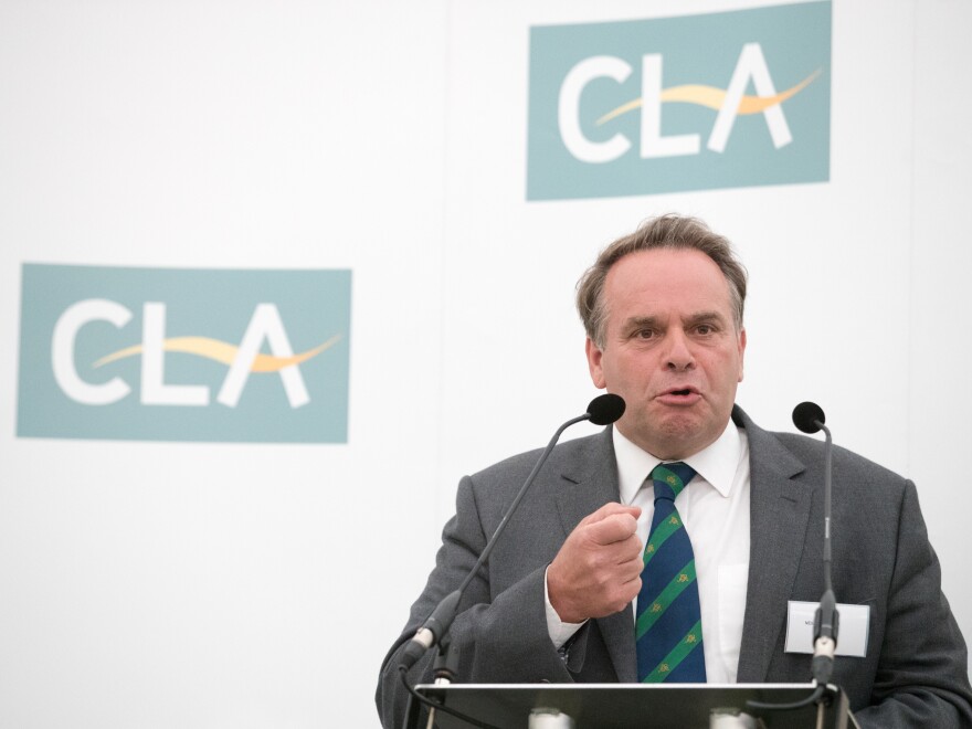 Conservative member of Parliament Neil Parish speaks at a business breakfast on June 1, 2016. He says he will resign after admitting that he watched porn in the House of Commons.