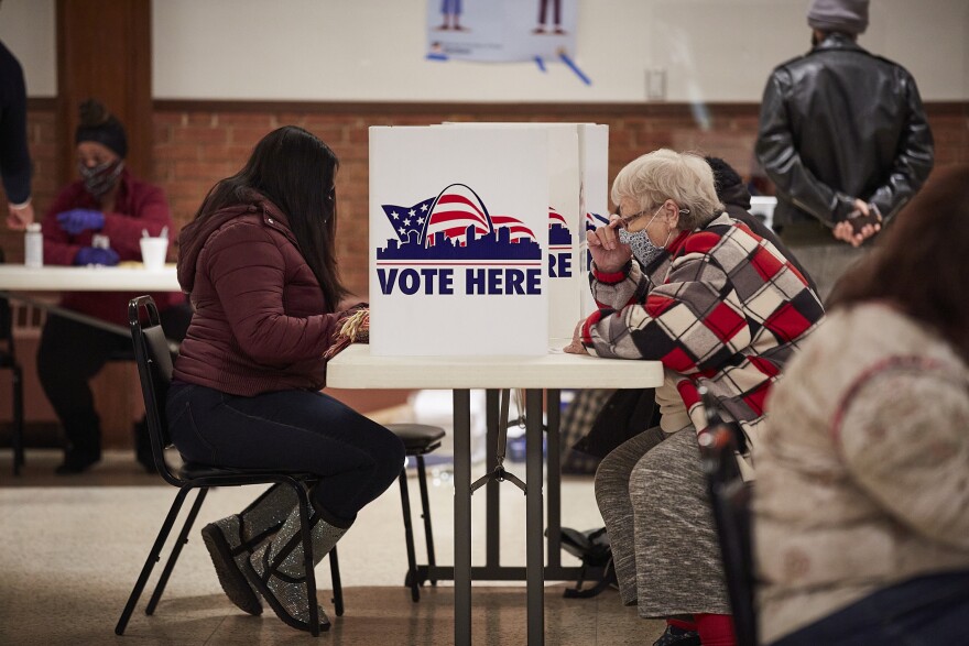 Congresswoman-elect Cori Bush (left) votes early Tuesday, Nov. 3, 2020, at Gambrinus Hall in south St. Louis