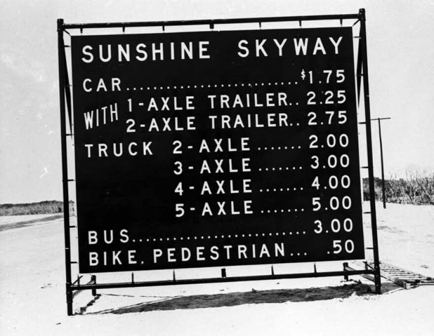 1954 toll sign - black and white photo 