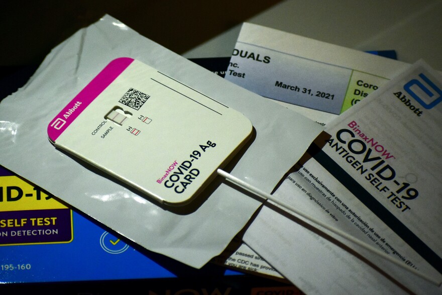 An at-home rapid test shows the person tested positive for COVID-19. IDOH reported nearly 97,000 new cases in the last week.