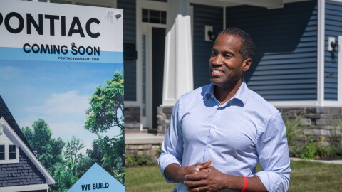 Congressman John James (R-MI 10) stands outside a newly-constructed home in Pontiac in September 2026.