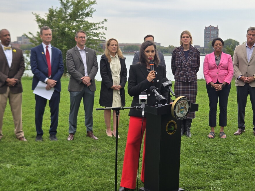 Michigan Governor Gretchen Whitmer speaks on Belle Isle, announcing a plan to put millions of dollars in settlement funds toward cleaning up pollution in the Detroit and Kalamazoo rivers.