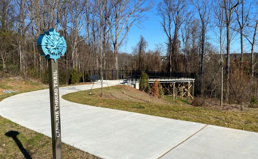 Western trailhead of the Antiquity Greenway, featuring a Carolina Thread Trail "lollipop sign"