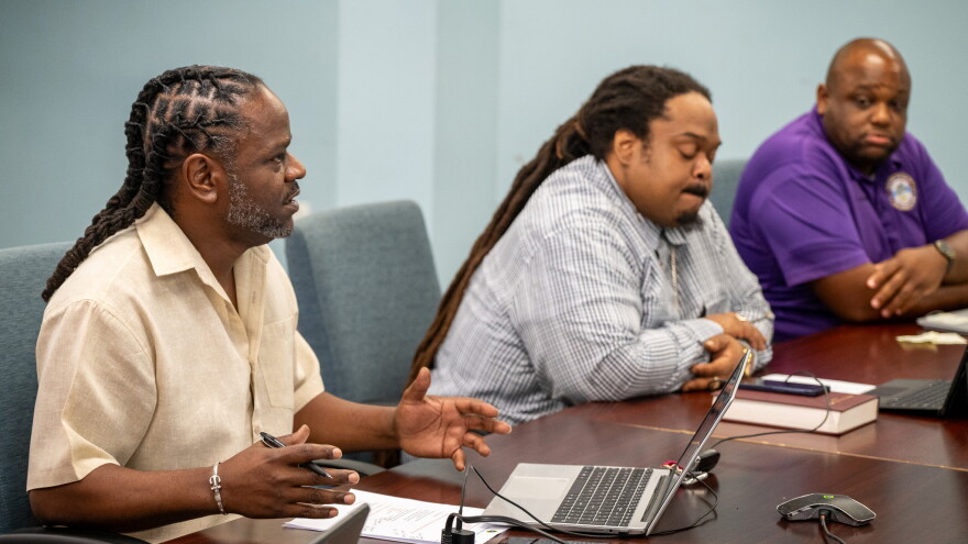 Pictured: Kareem Francis, left, speaks during a Virgin Islands Board of Elections meeting Tuesday at the Elections System of the Virgin Islands on St. Croix. Board member Franz Christian Jr., middle, and St. Croix Deputy Supervisor of Elections Terrell Alexandre are also pictured.