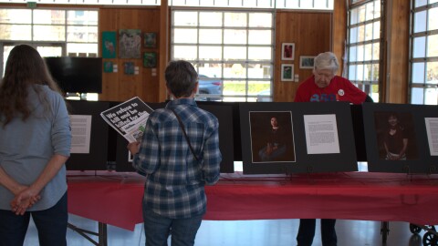 Eugene community members engage with art installations highlighting the stories of immigrants in Oregon on March 16, 2026.