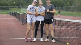 Teri Evans, right, coaches her daughters Cara, left, and Anna, center, on the Montrose girls tennis team. Cara won the Class 2A state championship last season and hopes for a repeat this year.