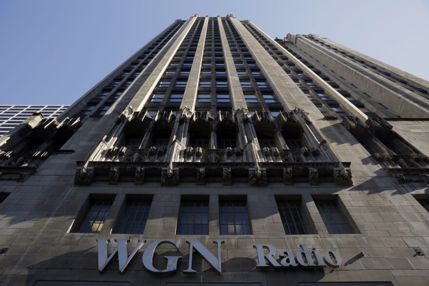 The WGN Radio sign appears on the side of Tribune Tower, Monday, May 1, 2017, in downtown Chicago. TV station operator Tribune Media is at the center of a possible bidding war, following reports that Fox News owner 21st Century Fox and investment firm Blackstone may make a joint takeover bid for the company. (Kiichiro Sato/AP)