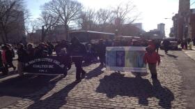 Participants in Cincinnati's annual MLK march walk to Music Hall.