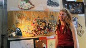 Kylee Jo Skimore, intern at Repurpose, explains the inspiration behind her piece. (Photos by Abigail Cherubin/WUFT News)