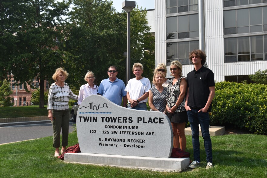 Family of the late developer G. Raymond Becker unveiled a new granite plaque dedicated to him outside the Twin Towers in downtown Peoria.