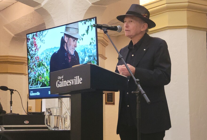 Musician Benmont Tench, founding member of Tom Petty and the Heartbreakers, addresses the audience after receiving a key to the city during Gainesville’s State of the City Address.