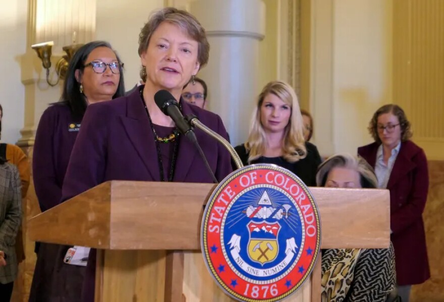 Kim Bimestefer, the executive director of Colorado's Department of Health Care Policy and Financing, speaks at a news conference unveiling a report on prescription drug costs, on Dec. 12, 2019.