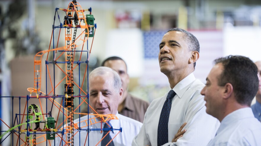 President Obama examines a K'NEX roller coaster on Nov. 30 at a Hatfield, Pa., factory that makes the toys. During the visit, Obama spoke about the economy, the middle class and his plan to raise taxes on top wage earners.