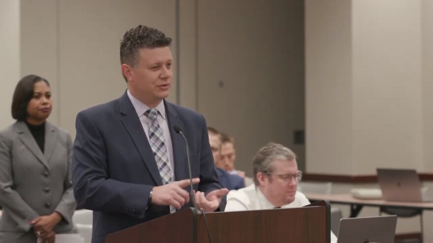 Hammond School Superintendent Scott Miller speaks to the State Board of Education Dec. 7, as Assistant Superintendent of Academic Services (left) listens.