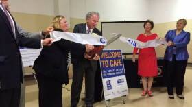 Community organization representatives celebrate the opening of the new Center for Working Families location.