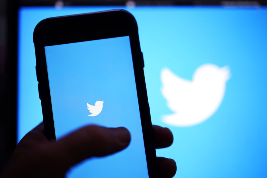 FILE - The Twitter application is seen on a digital device, April 25, 2022, in San Diego.  Elon Musk, the world's richest man and the owner of SpaceX and Tesla, says he is a free speech absolutist who doesn't support the kind of content moderation that saw people like ex-President Donald Trump get banned for inciting violence. (AP Photo/Gregory Bull, File)