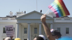 In this 2017 photo, Equality March for Unity and Pride participants march past the White House in Washington.