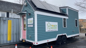 The Cornell Cooperative Extension's PowerHouse is a mobile exhibit on ways to reduce their energy use inside a home. Participants in the organization's Energy Warriors green jobs training program toured it in March to learn more about insulation and reducing building emissions.