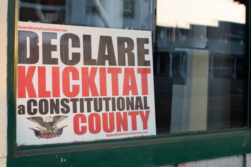 A sign in support of Klickitat County adopting a constitutional county resolution rests in the window of a storefront in Goldendale, Washington on July 5, 2023. The controversial resolution was submitted for consideration by Klickitat County Sheriff Bob Songer in 2022.