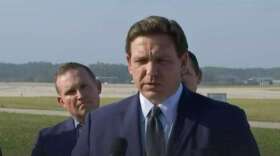 Gov. Ron DeSantis held a news conference at Jacksonville International Airport to announce a crackdown on illegal migrants. (Newsjax4/WJCT)
