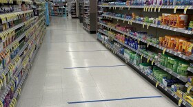 Tape at a Walgreens in Springfield shows customers where to stand to stay 6 feet apart. 