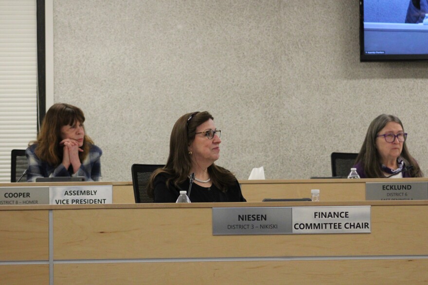 From left, Kelly Cooper, Lenora Niesen and Cindy Ecklund participate in a borough assembly meeting on Tuesday, Feb. 3, 2026 in Soldotna, Alaska.