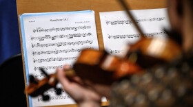 A violinist of Nexus orchestra performs during a rehearsal in Lausanne on Sept. 2, 2021. (Fabrice Coffrin/AFP via Getty Images)