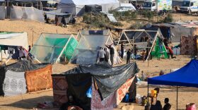 Displaced Palestinians who fled from Khan Yunis, build shelters in Rafah in the southern Gaza Strip.