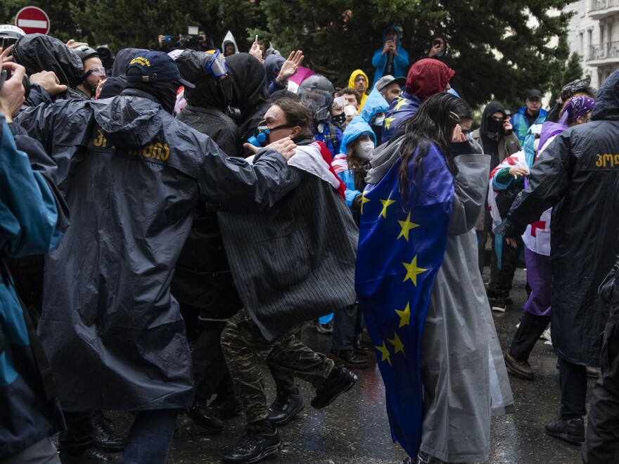 Demonstrators clash with police as two Americans and one Russian citizen are among 20 detained during a protest against the foreign agents law on Monday in Tbilisi, Georgia.