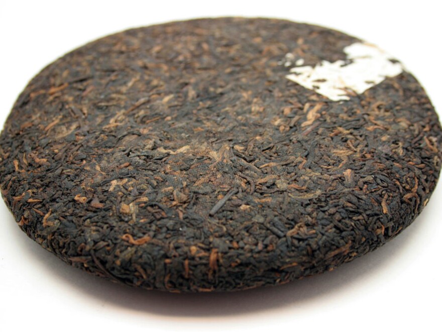 Pu'er is routinely compressed into cakes, called <em>bings</em>, and wrapped in paper printed with the name of the tea.