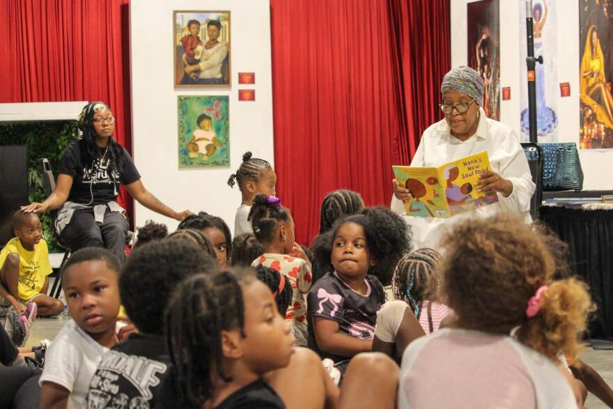 Cherice Harrison-Nelson reads to campers at Kuumba Academy in New Orleans on July 9, 2026.