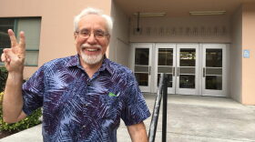 Gil Villagran stands in front of the administration building at San Jose State University. He now teaches at the School of Social Work, but was expelled in the 1960s after participating in an anti-war protest. (Rachael Myrow/KQED)