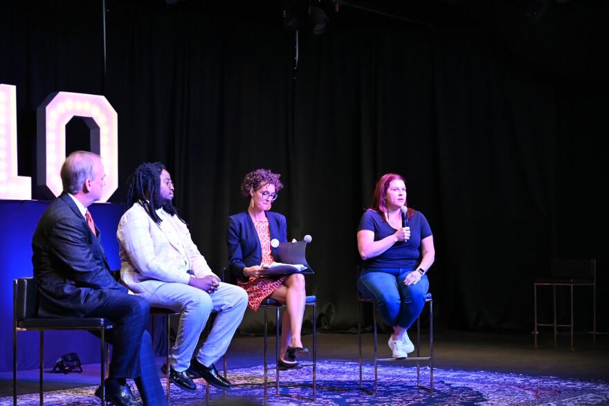 Panelists Brad Carson (far right), Edward Ongweso Jr, and moderator Clara Mattei listen as State Representative Amanda Clinton answers a question from an attendee.