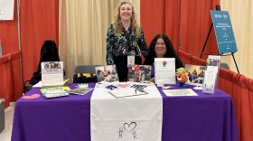 The Grief Center of New Mexico, including Director Jade Richardson Bock (left) and Barbara Cotton, hosts a booth at the student health and education Head to Toe conference in Albuquerque. The group led a training for educators on supporting grieving students during Children's Grief Awareness Month on Nov. 15, 2023.