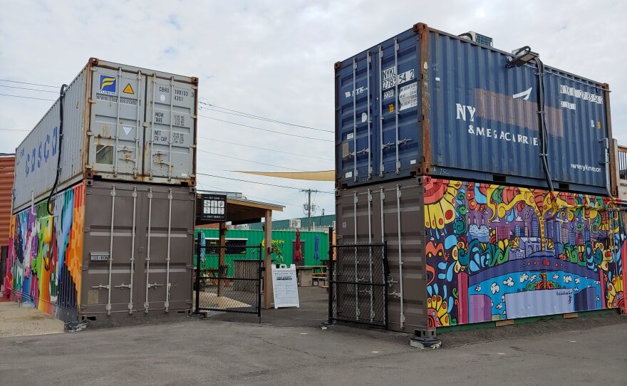 The Iron District has a courtyard enclosed by it's shipping container food vendors.