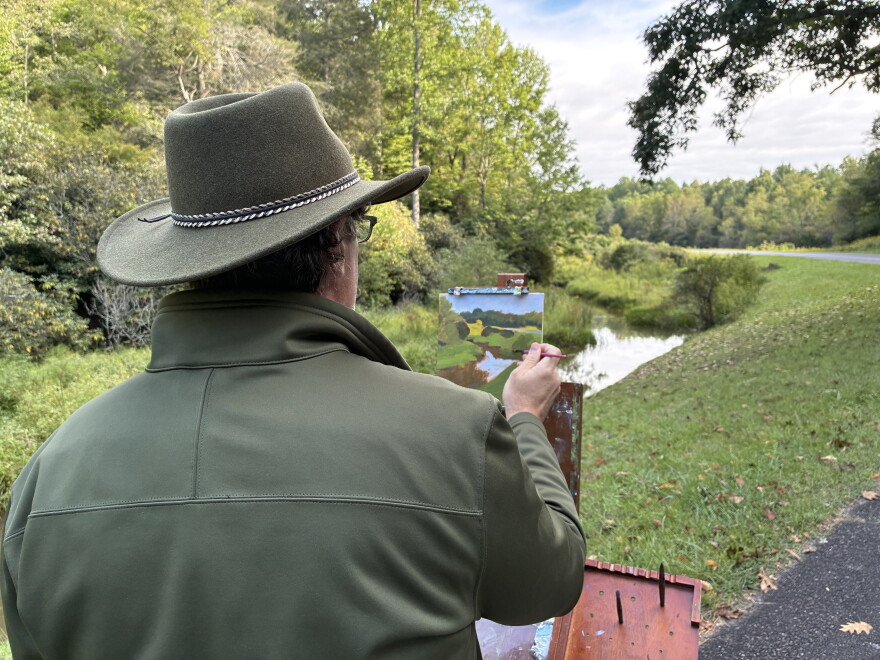 Sean Hatter paints an image of Rakes Mill Pond during the 2026 Floyd Plein Air biennial.