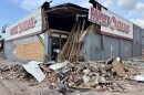 Bricks and other material piled up outside the Family Dollar store on Broadway after a partial building collapse.