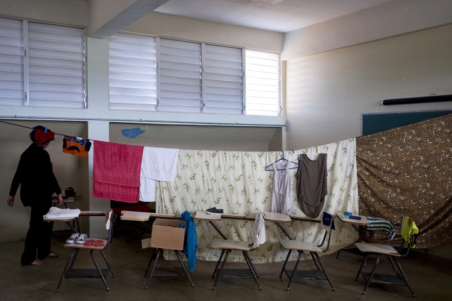 Families displaced by Hurricane Maria have been living at Liberata Iraldo middle school, which is serving as a shelter for people who lost their homes in the storm.
