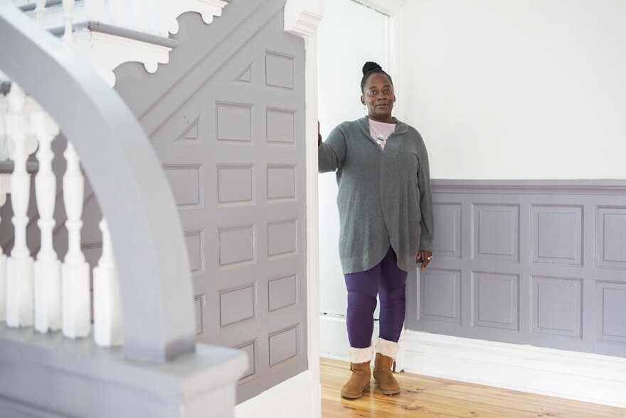 Tawana Lawson inside her new home in JeffVanderLou on December 4, 2019. Lawson has worked with north St. Louis kids for years and will continue her outreach work as part of a rent-to-own agreement with nonprofit LOVEtheLOU.