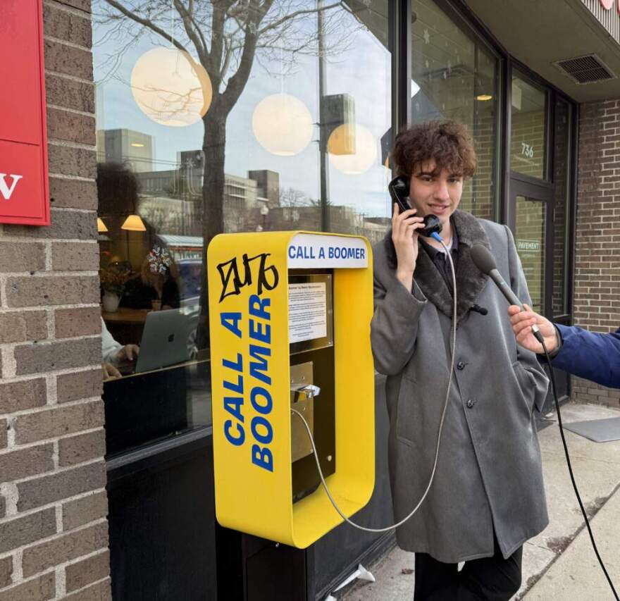 Ryan Marcantonio uses the Boston payphone. (Michael Scotto/Here & Now)