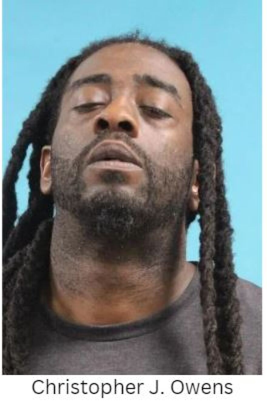 Mugshot of Christopher Owens with dreadlocks and wearing a dark T-shirt